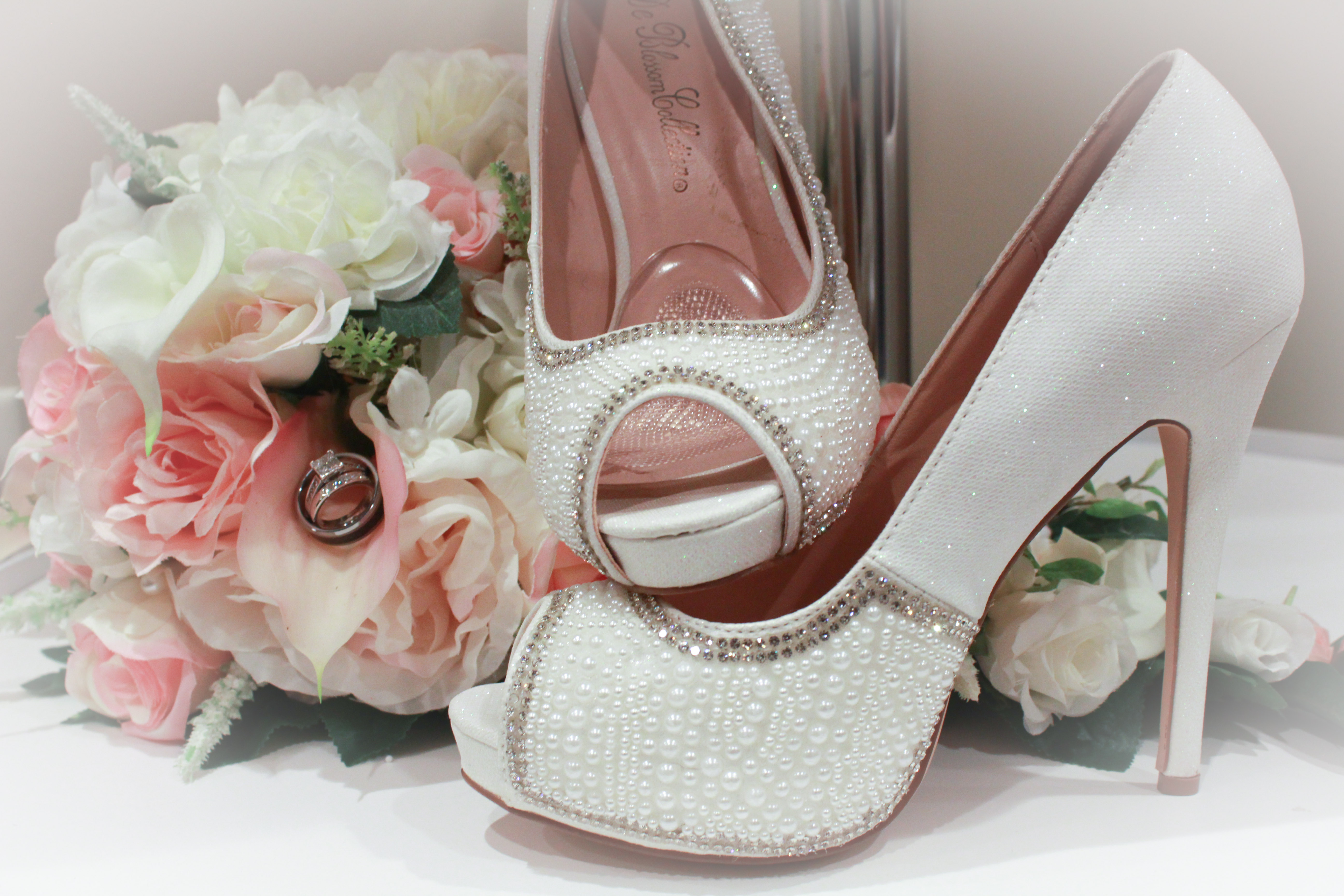 bride's bouquet and wedding shoes pink