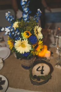 rustic blue and yellow sunflower centerpiece