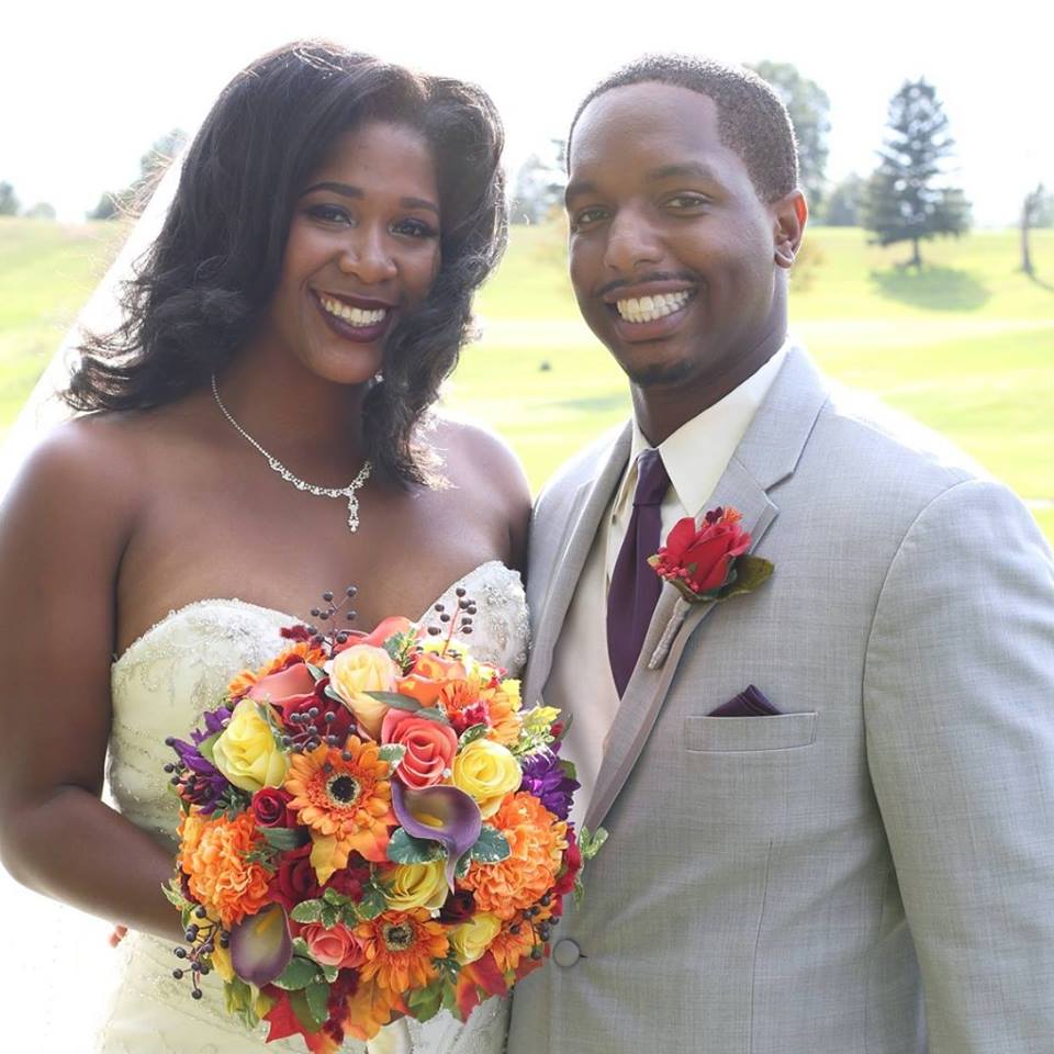 bride and groom with fall flowers during wedding at chestnut ridge gold resort