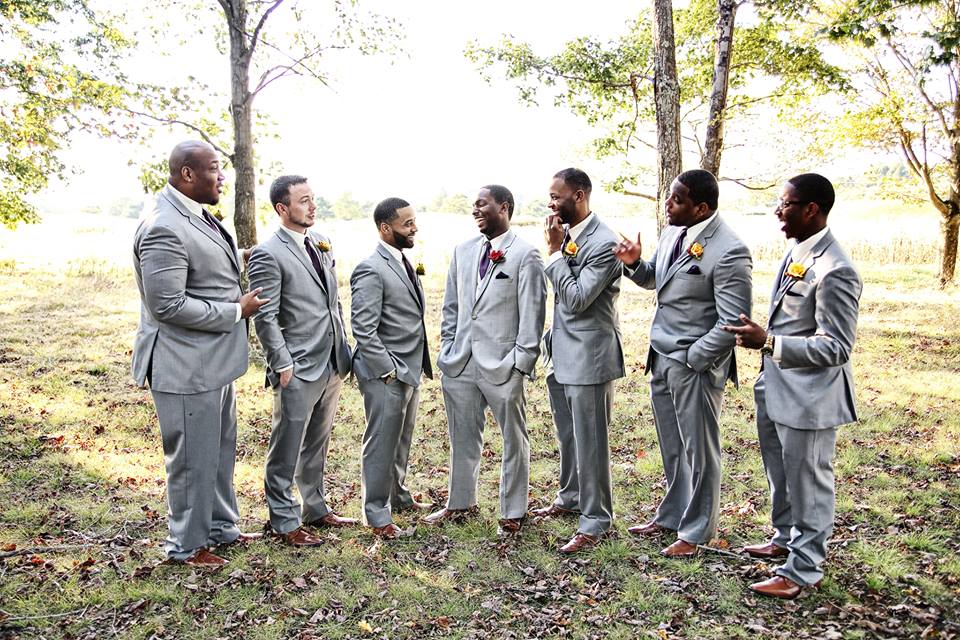 groom and groomsmen laughing at chestnut ridge golf course wedding